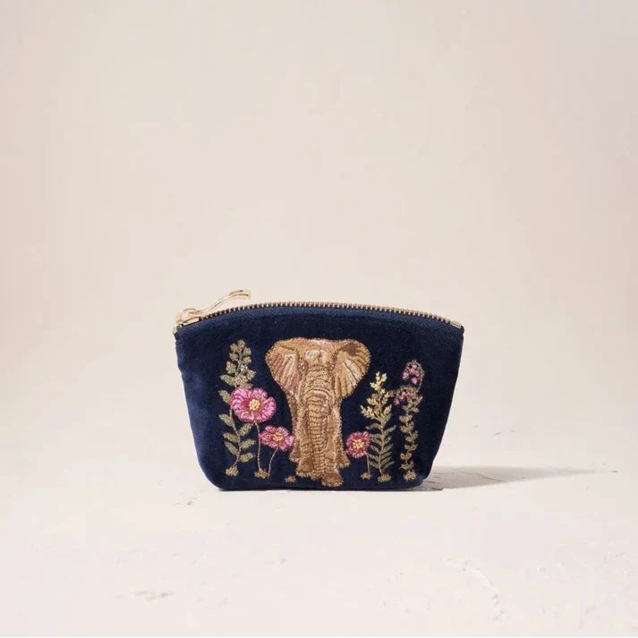 Navy blue pouch with embroidered elephant and flowers on a light beige background