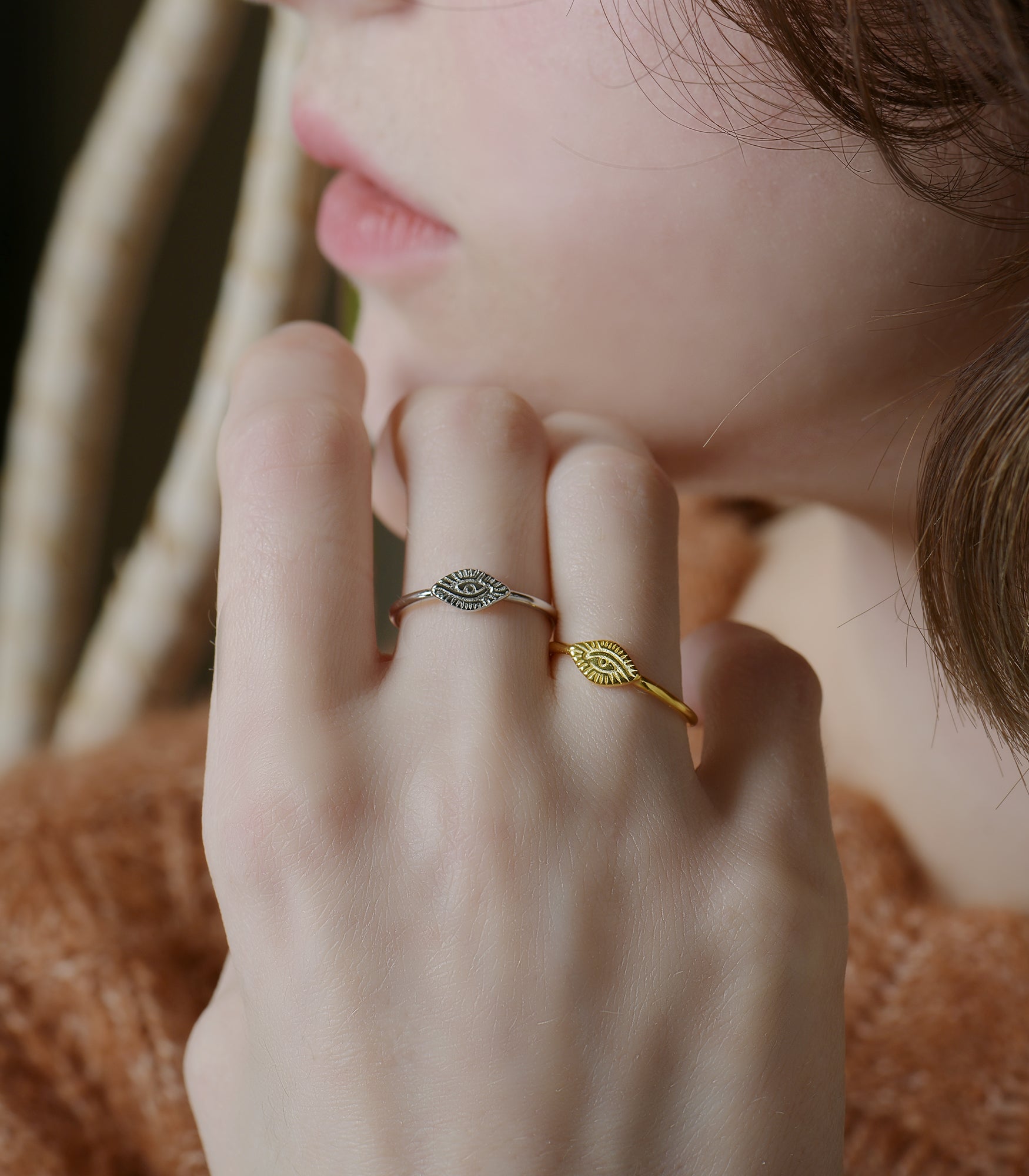 Two gold vermeil and sterling silver rings with an open band design and the eye of providence featuring at the front.