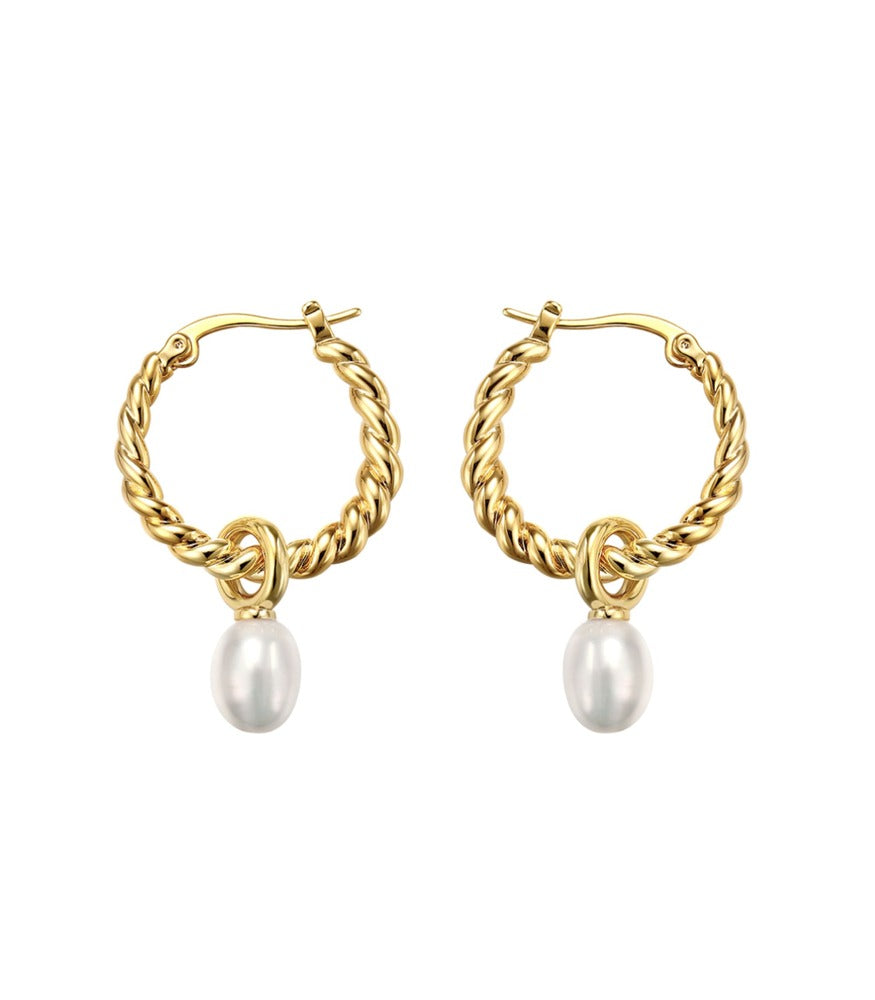A pair of gold plated twisting hoop earrings. The twisting hoop earrings have two white pearls delicately hanging from them.