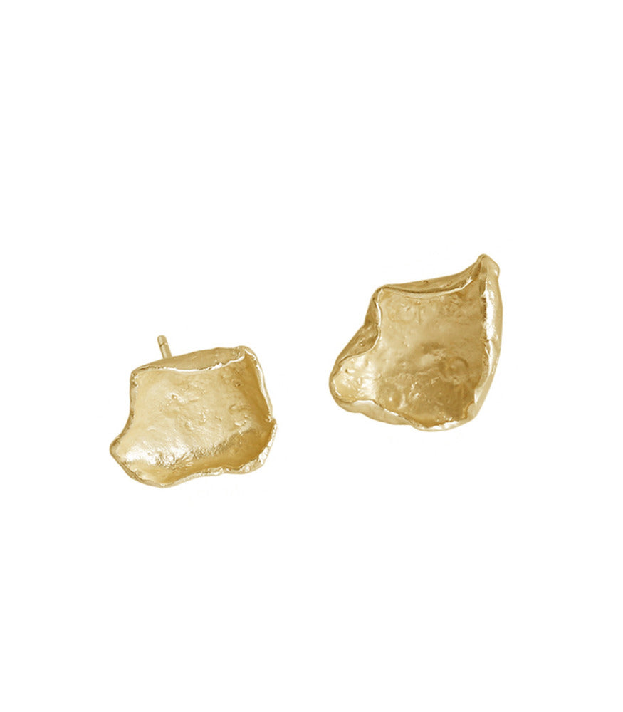 A pair of gold plated sterling silver earrings, curved at the edges, reflecting petals or fragmented paper.