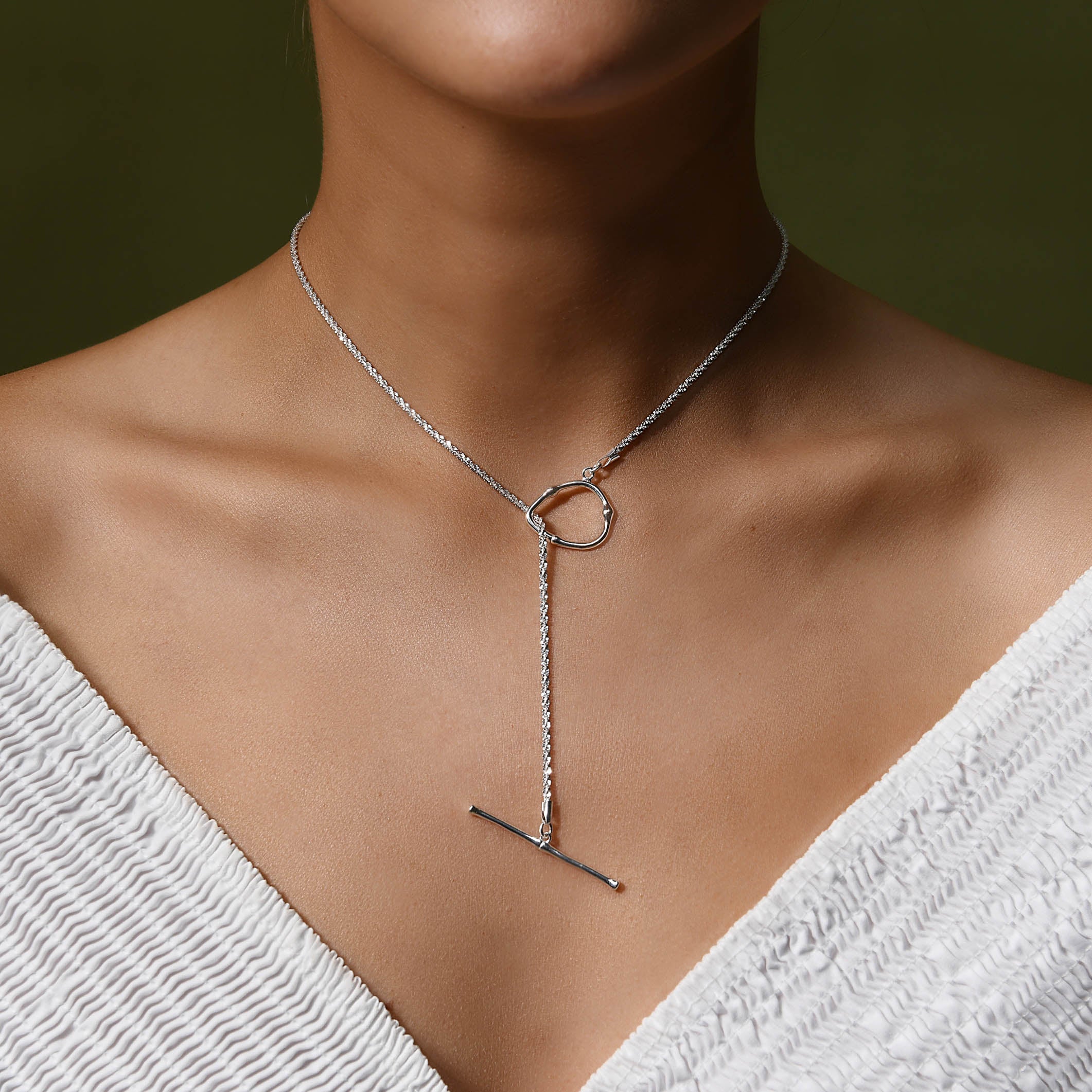 shimmering silver chain necklace finished with a silver toggle for adjusting length