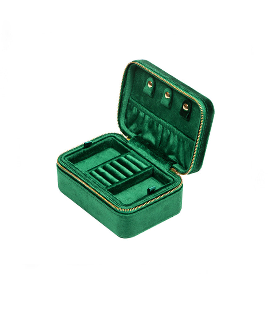 A dark forest green velvet jewellery box in a rectangle shape. The box has two layers with difference compartments for jewellery.