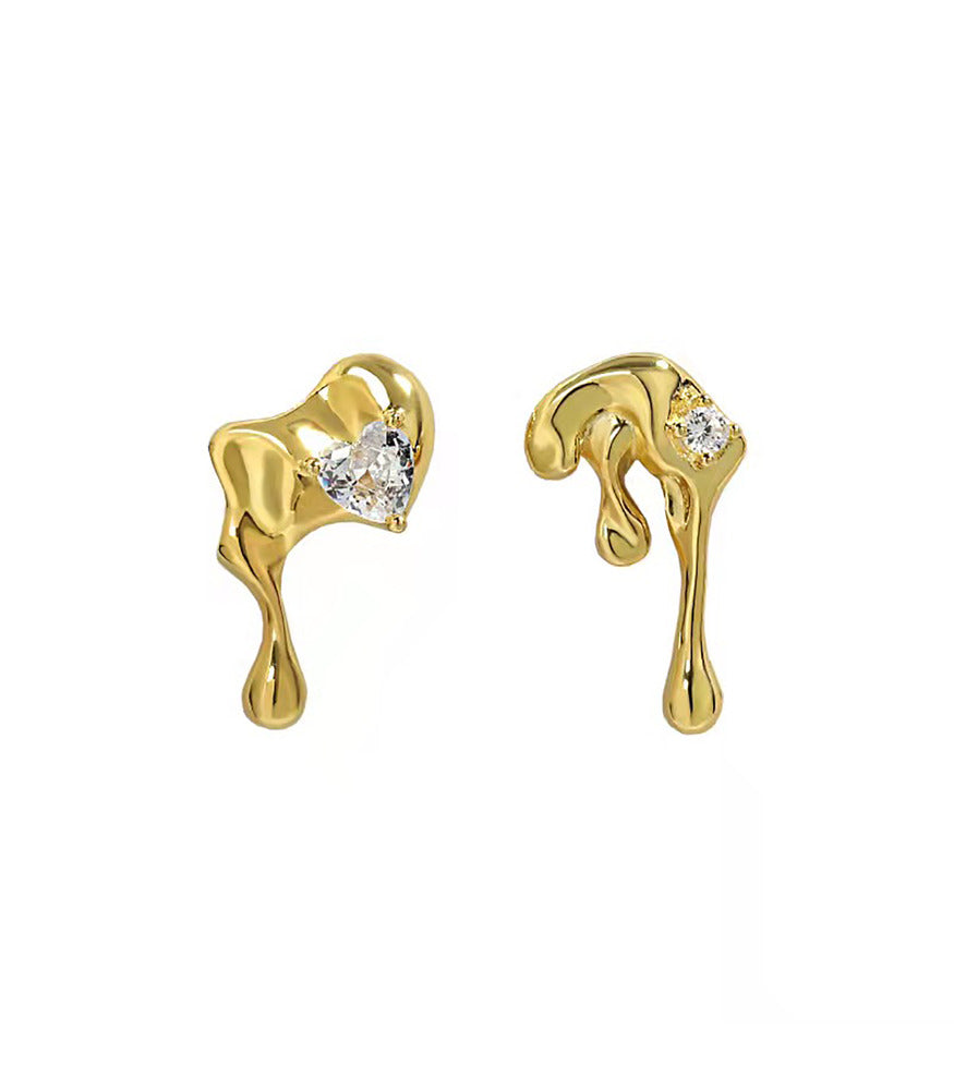 A pair of gold vermeil earrings, shaped to resemble water droplets. The earrings feature beautiful sparkling clear gemstones.