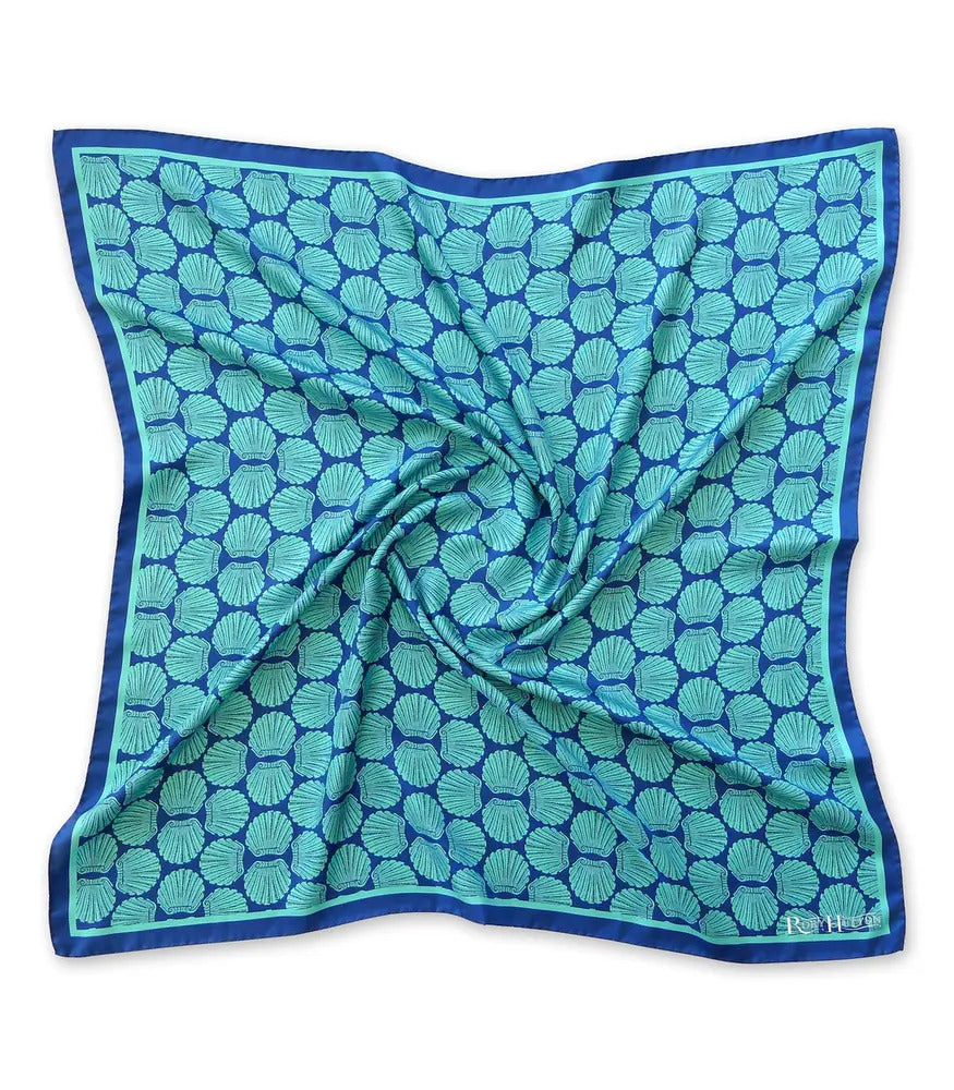 A silk blue and turquoise scarf with a seashell print.
