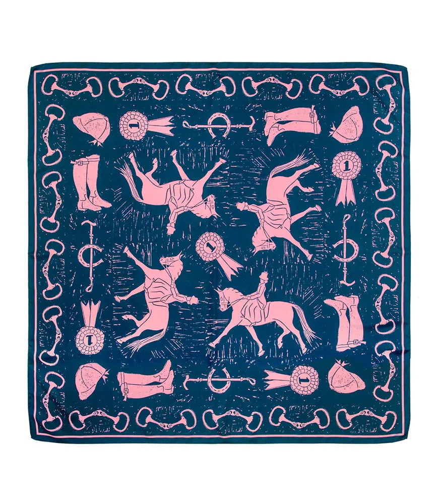 A blue and pink silk scarf with a linocut print featuring horse motifs, riding boots and horseshoes.