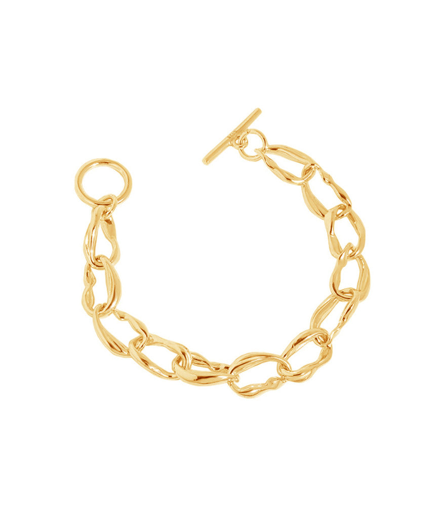 A gold vermeil bracelet with a toggle clasp fastening. The bracelet is made up of irregular shaped rings linking together.