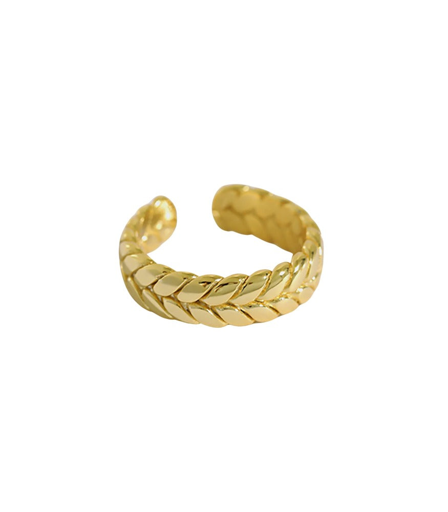 A gold plated ring. The band of the ring is detailed with a twisting braid effect. 