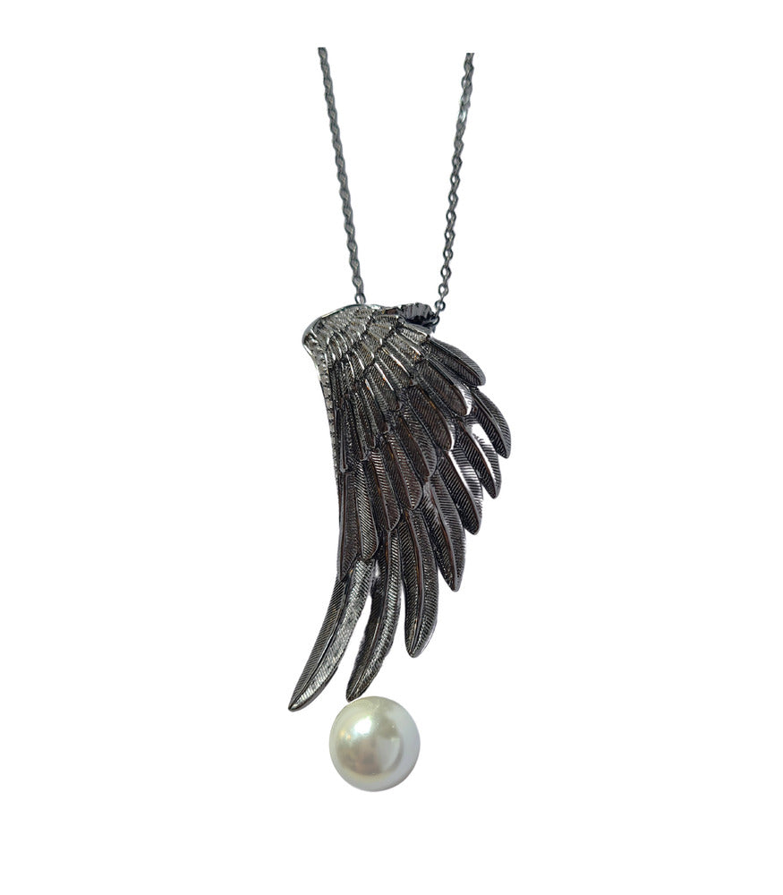 An oxidised sterling silver wing pendant with a white pearl hanging from a chain.
