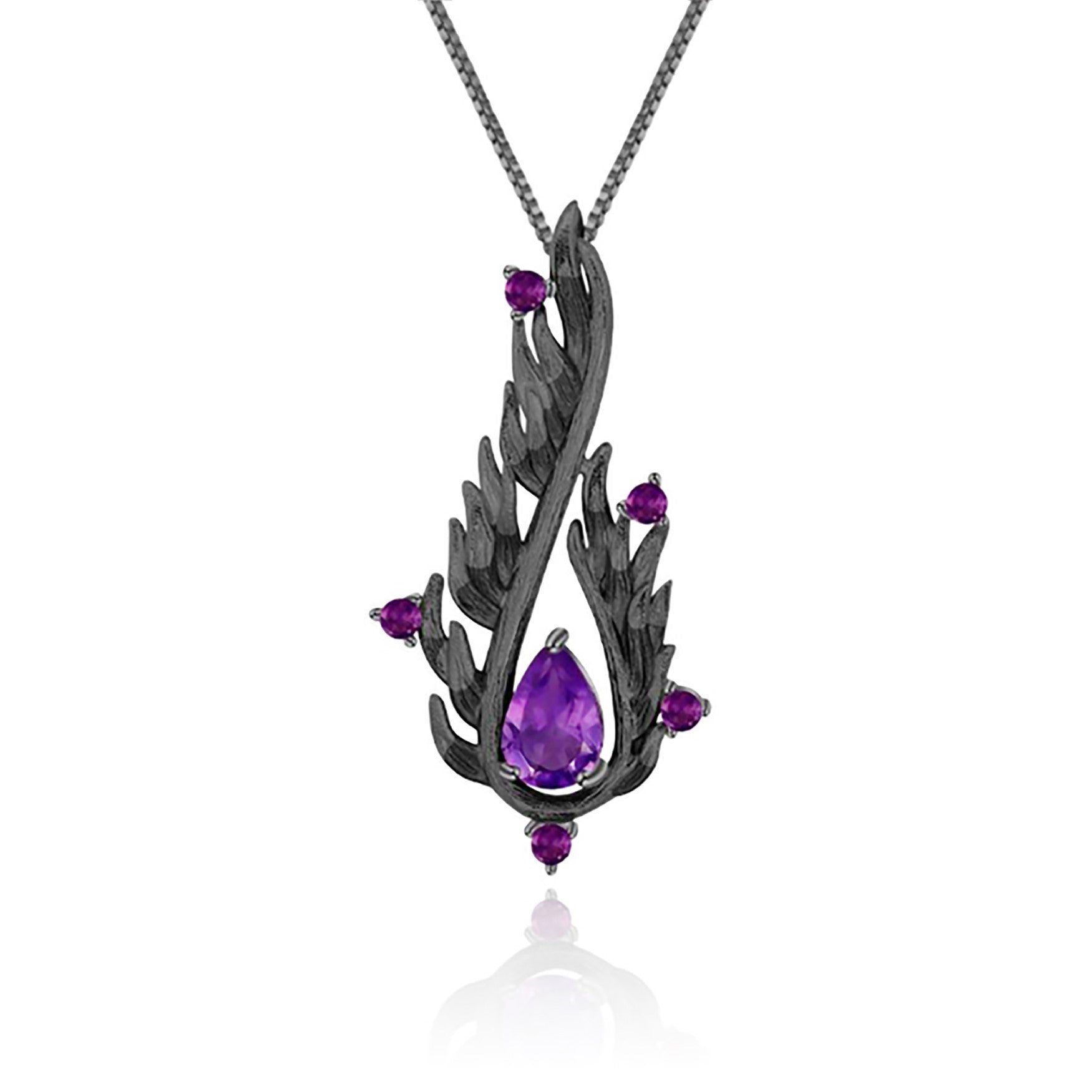 An oxidised sterling silver teardrop shaped necklace with purple amethyst stones.