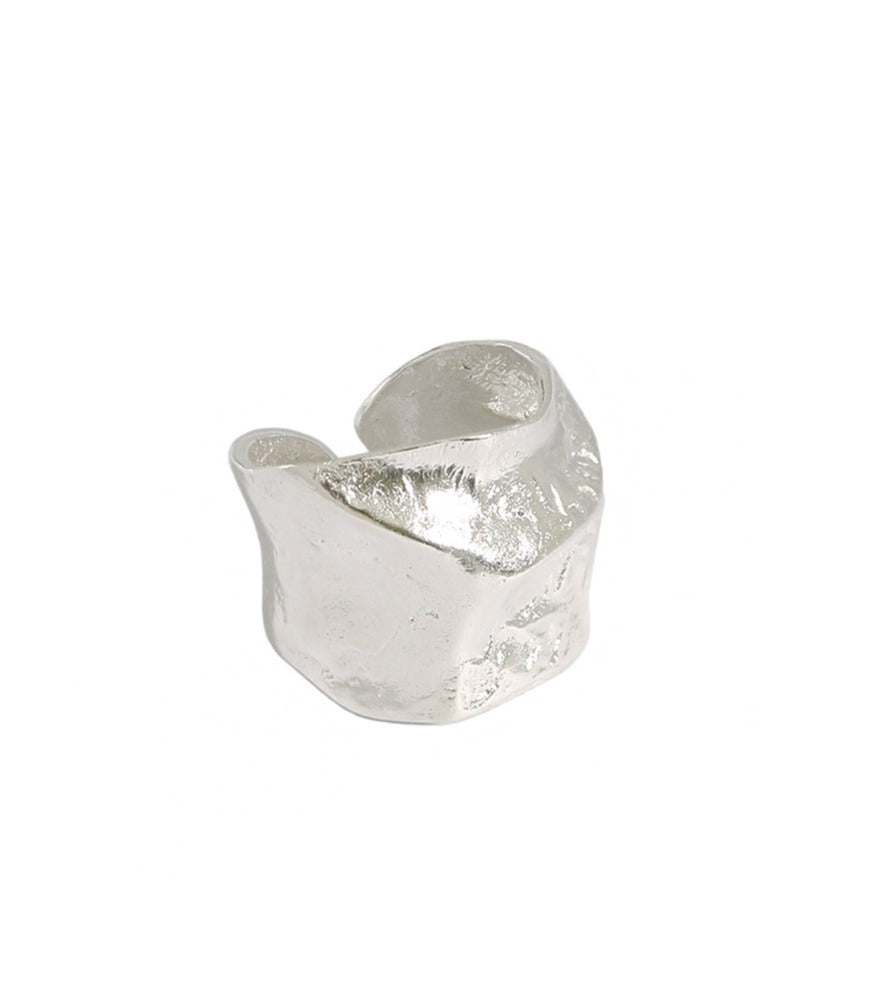 A sterling silver ring. The ring has a thick chunky band which has a brushed texture.   
