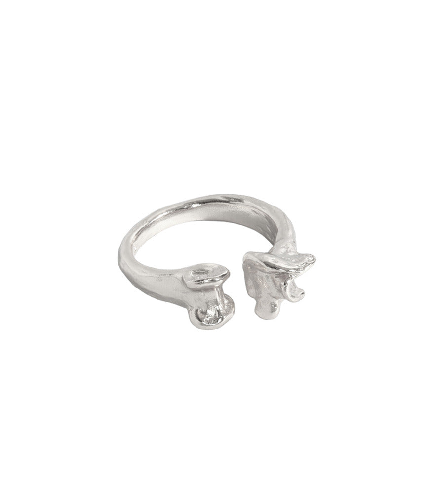 A sterling silver open band ring. The ring has a bone detailing on the end of each side of the band.