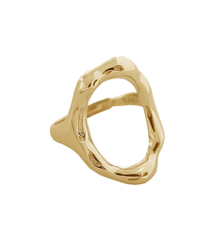A gold vermeil ring with an oval shaped design at the front of the ring.