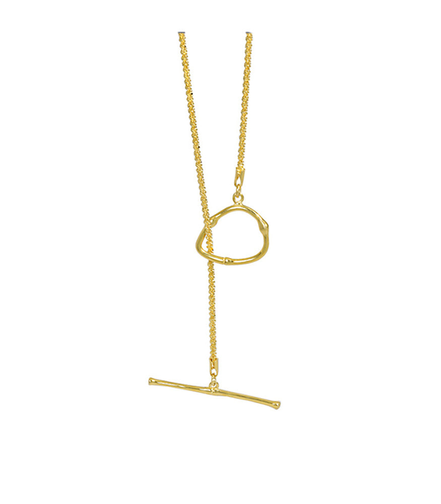 A gold vermeil necklace. The necklace has a dainty chain and toggle clasp which can be worn at the front or back.