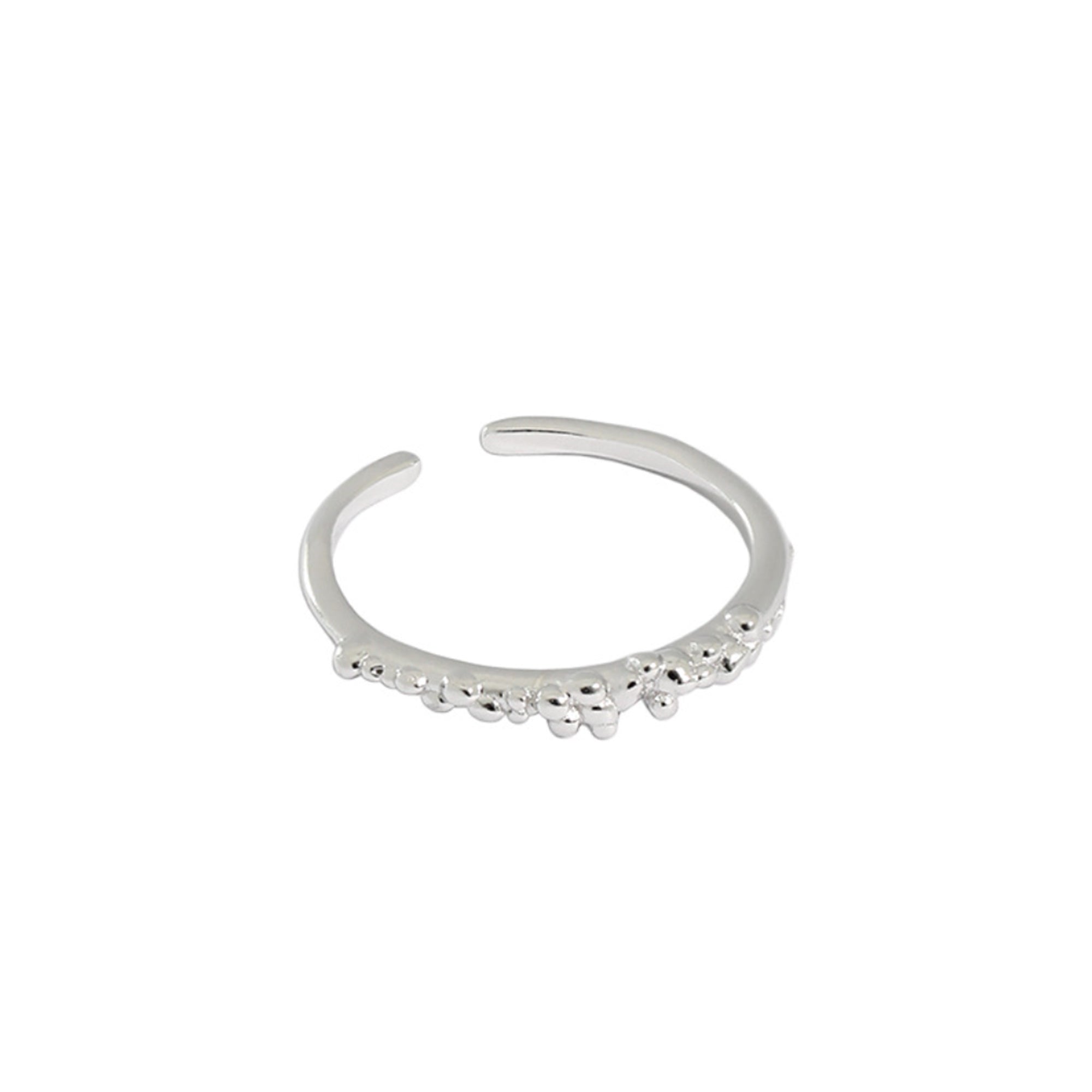 A sterling silver ring with a dainty band and a bubbled texture at the front of the ring.