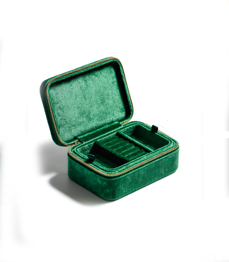A dark green, velvet jewellery box with two layers. The box is a rectangular shape and has a zip fastening.