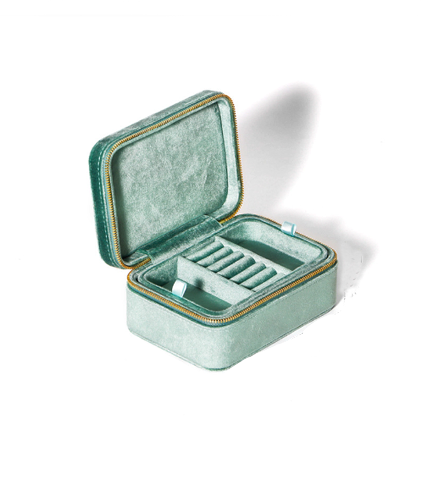 A mint coloured jewellery storage box with two layers and a zip fastening. 