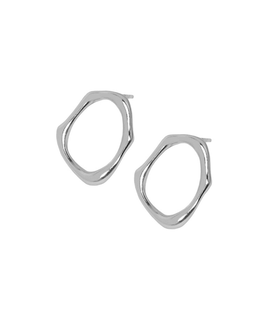 A pair of sterling silver circle stud earrings. The earrings resemble waters movements.