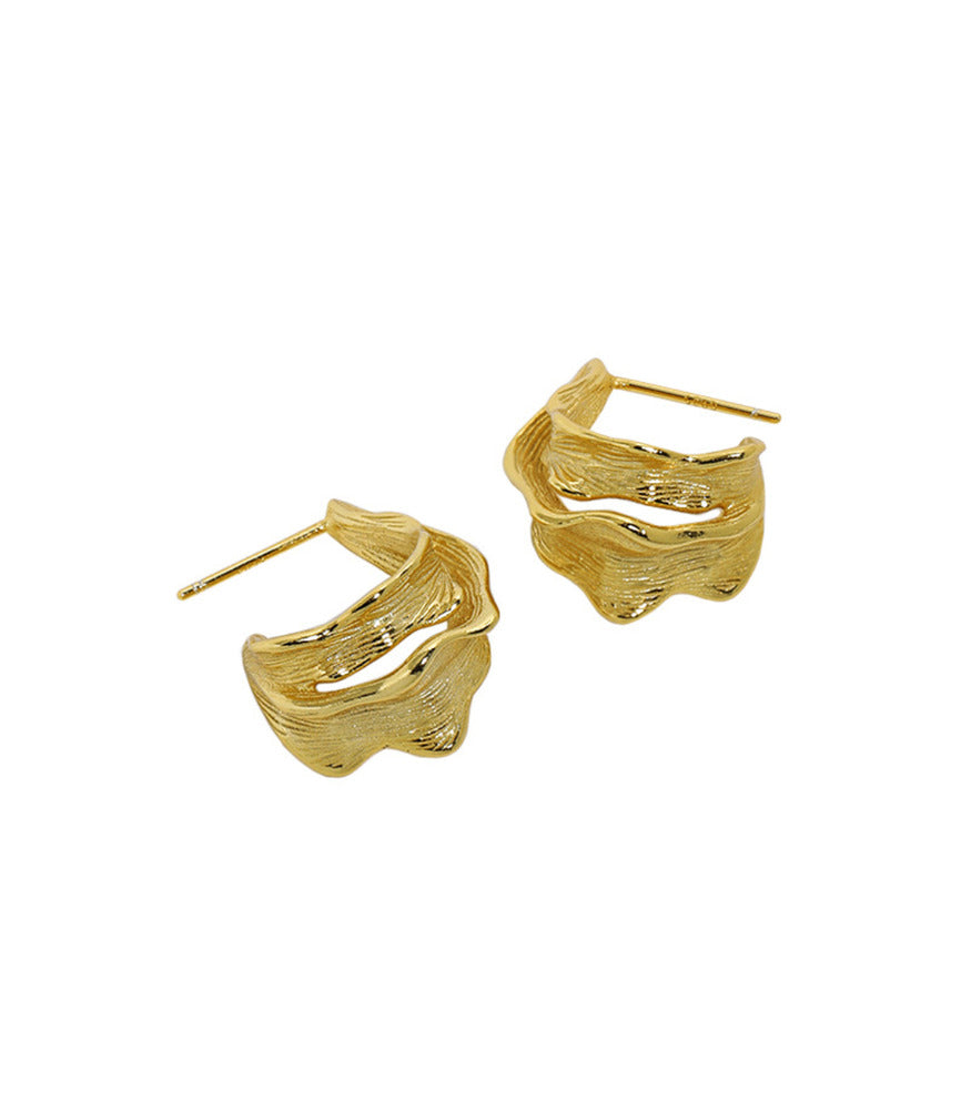 A pair of gold vermeil, textured large leaf hoop earrings.